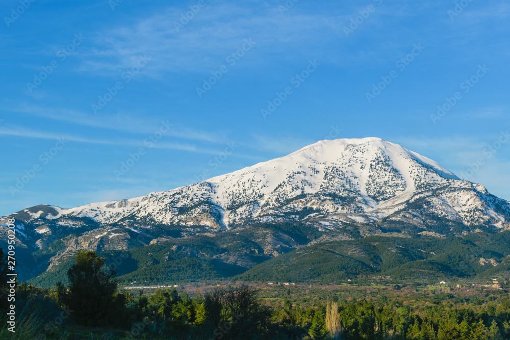 Fototapeta premium Difrys mountain covered in snow, Evia
