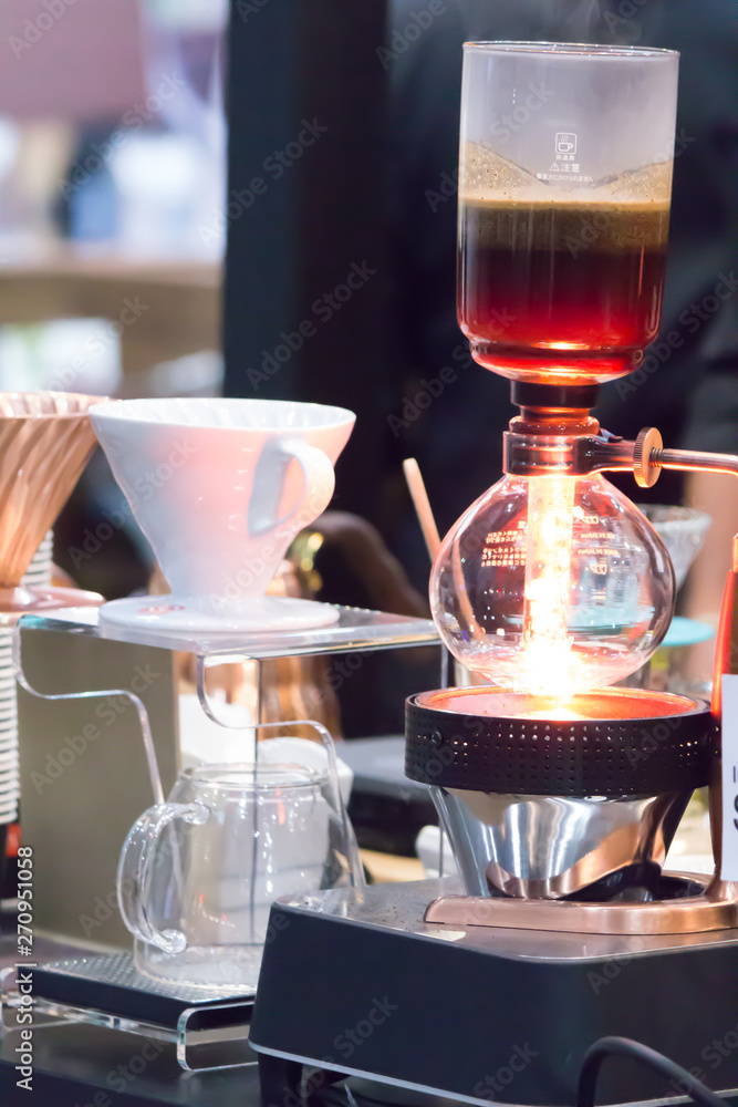 Syphon Coffee or Vacuum Coffee is full immersion tasteful and Barista mix coffee and hot water in vacuum glass chambers by Beam heater.