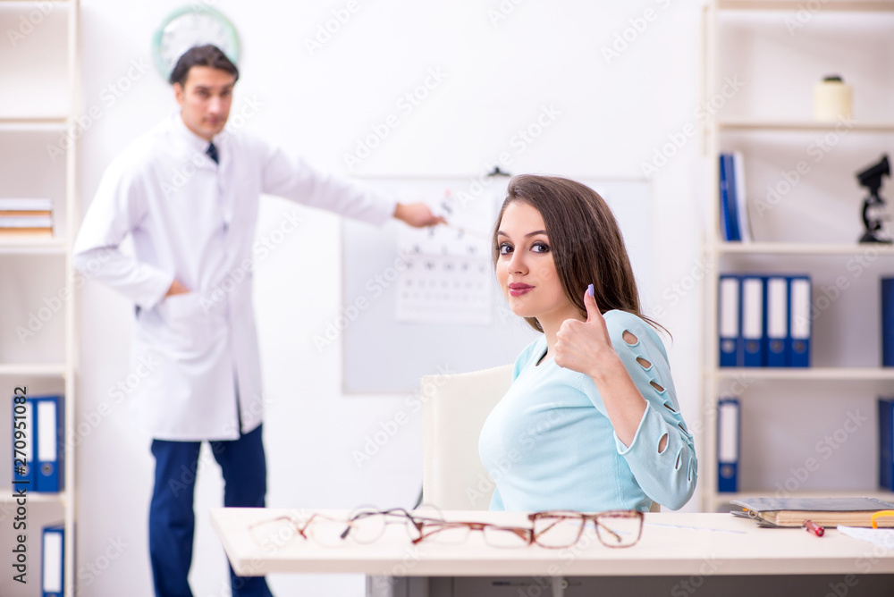 Young woman visiting male doctor oculist Young woman visiting male doctor oculist
