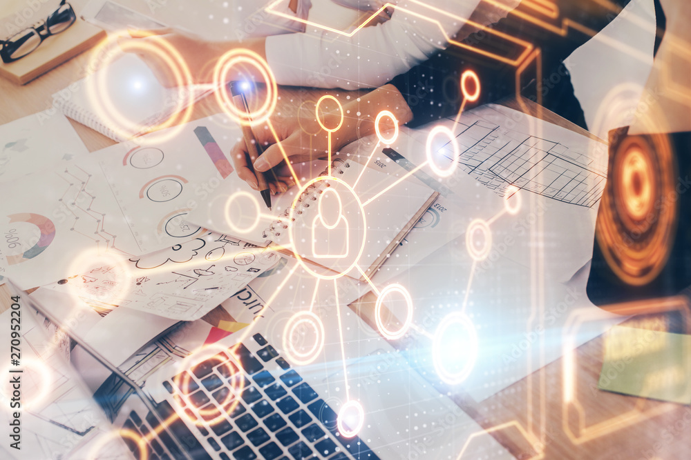 Social network theme hologram over hands taking notes background. Concept of global international people connect. Double exposure Social network theme hologram over hands taking notes background. Concept of global international people connect. Double exposure