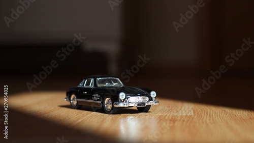 black toy car - model