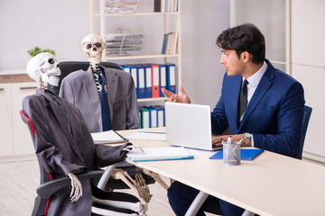 Funny business meeting with boss and skeletons