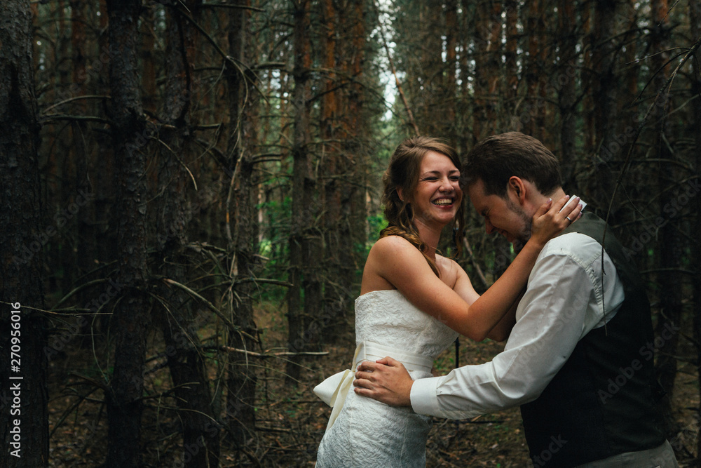 bride and groom in the forest of firs bride and groom in the forest of firs