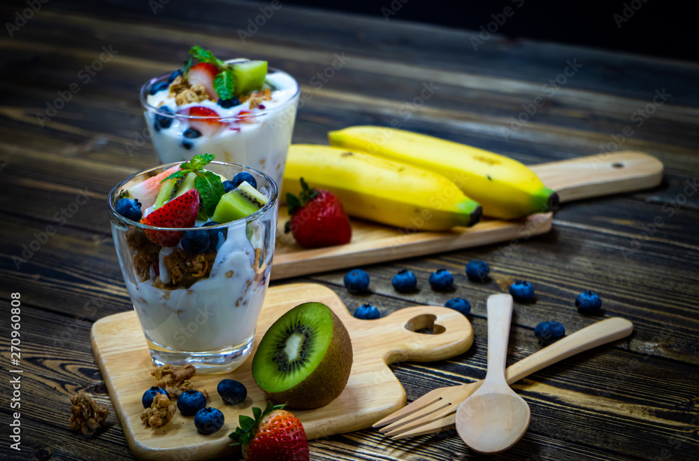 Snacks with yogurt, muesli and fresh berries, fresh kiwi, fresh strawberries, healthy food and good weight loss. Snacks with yogurt, muesli and fresh berries, fresh kiwi, fresh strawberries, healthy food and good weight loss.