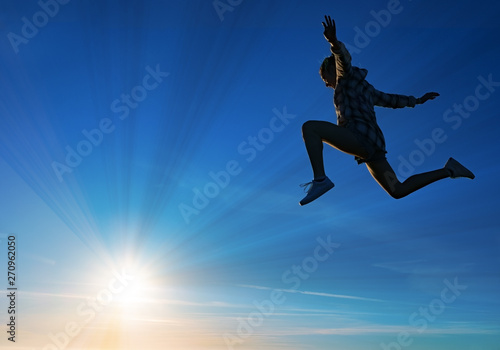 girl doing sports with the sun in the background, celebrating freedom and success