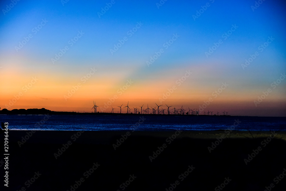 sunset in wind farm brazil bullring beach, horizon line, landscape