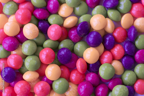 Background made of colorful dragee. A lot of round candies.