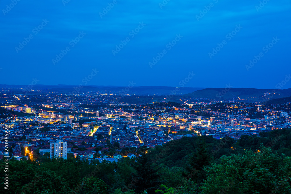 Germany, Stuttgart state capital houses of big city from hilltop of mount rubble in magical twilight mood by night