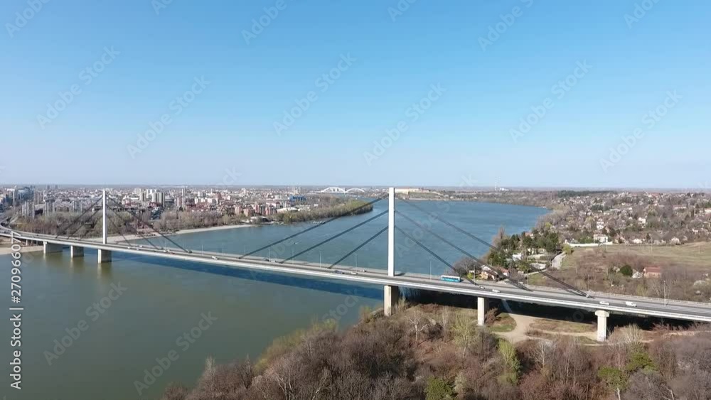 Aerial view of Liberty or Freedom bridge (Serbian - Most slobode) in Novi Sad, Serbia with Danube river city streets and cars driving view from above Aerial view of Liberty or Freedom bridge (Serbian - Most slobode) in Novi Sad, Serbia with Danube river city streets and cars driving view from above