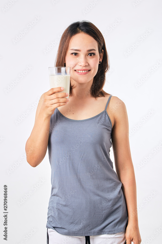 Woman holding a glass of milk Woman holding a glass of milk