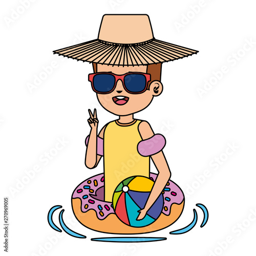 cute little boy with donut float and beach balloon