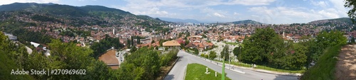 Bosnia and Herzegovina: aerial view of the skyline of the capital Sarajevo, surrounded by the Dinaric Alps and situated along the Miljacka River, seen from Zuta Tabija (Yellow Fortress) 