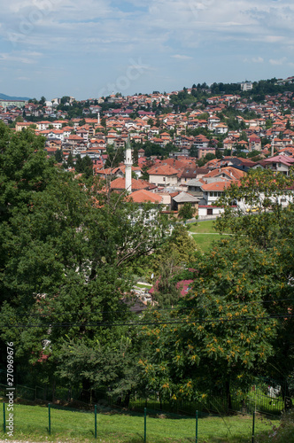 Bosnia and Herzegovina: aerial view of the skyline of the capital Sarajevo, surrounded by the Dinaric Alps and situated along the Miljacka River, seen from Zuta Tabija (Yellow Fortress) 