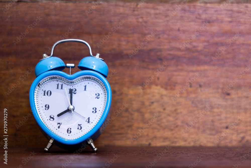 Heart shaped alarm clock on wooden background. Eight O Clock Heart shaped alarm clock on wooden background. Eight O Clock