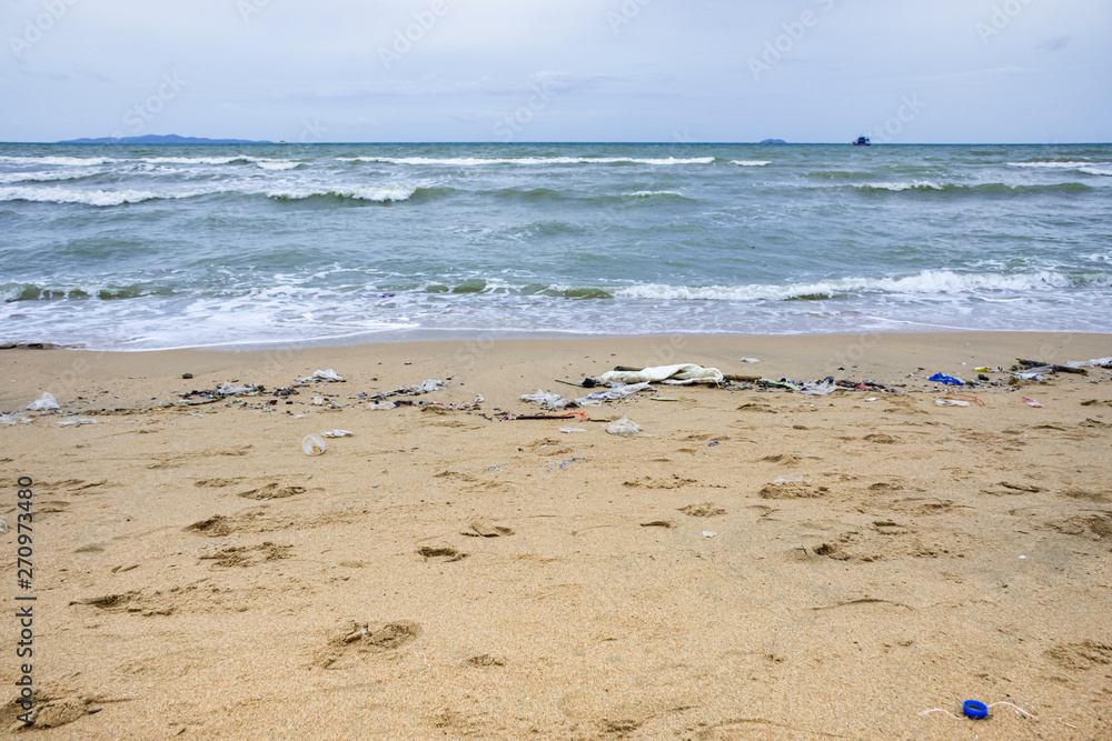 A lot of plastic debris littered on the beach, Pattaya beach ,Thailand, The environment is detroyed by human, Waste water sea from the neglect of human A lot of plastic debris littered on the beach, Pattaya beach ,Thailand, The environment is detroyed by human, Waste water sea from the neglect of human