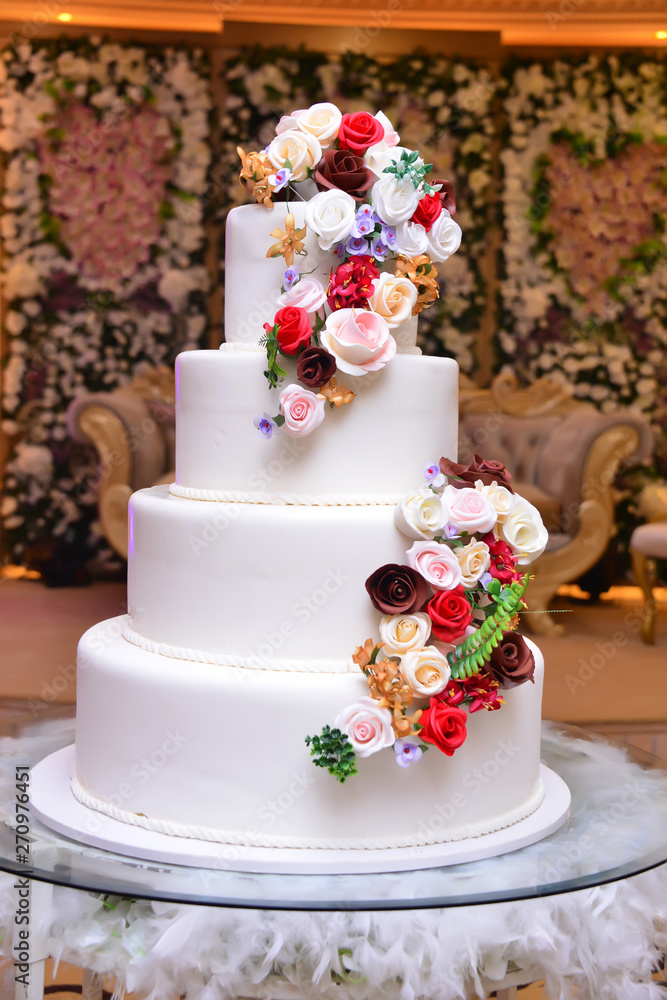 Wedding cake decoration with colorful flowers, it is served at wedding receptions. Vintage style for weddings, birthdays.