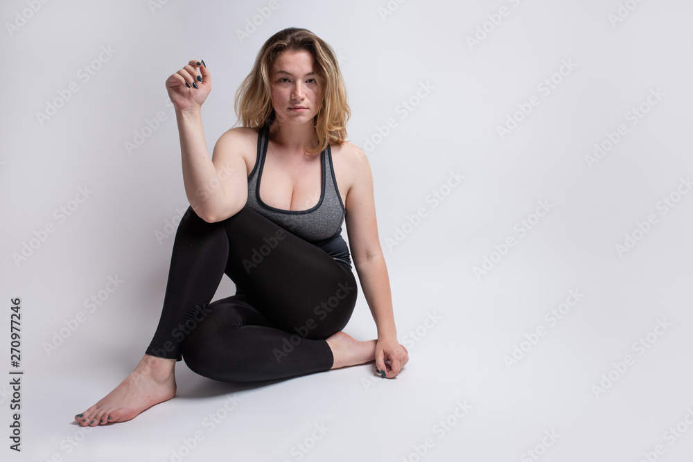 Female doing body stretches for dance and yoga class Female doing body stretches for dance and yoga class