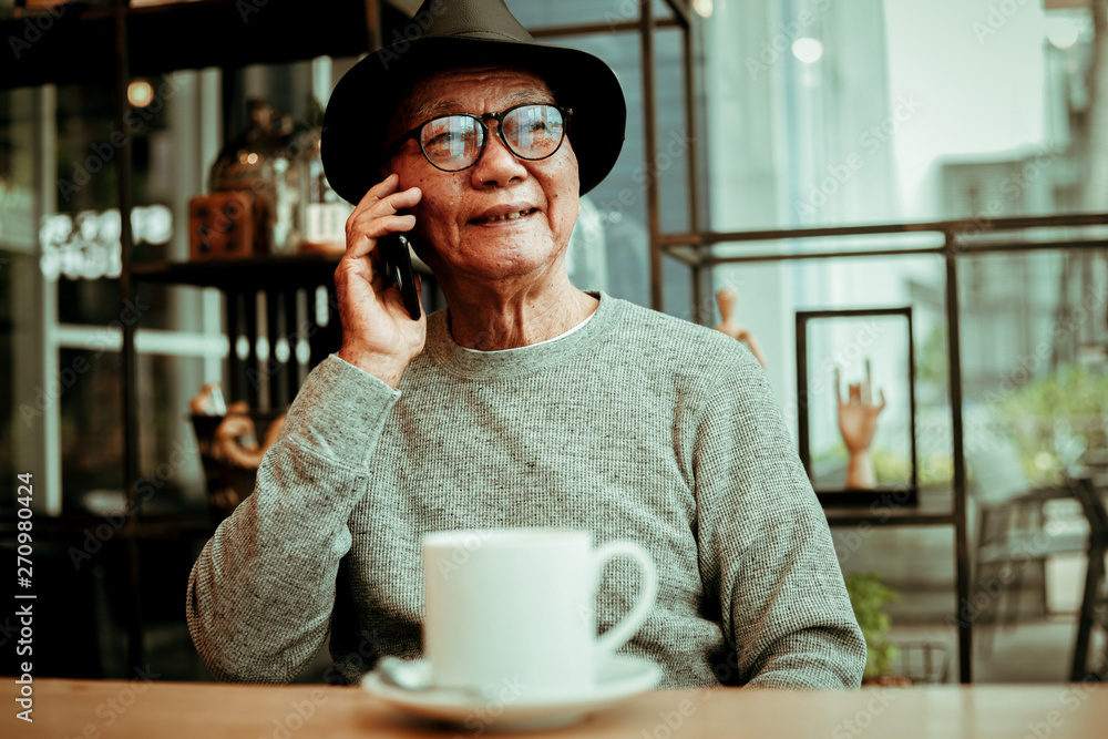 Asian senoir old man retirement drinking coffee in cafe smile and happy face Asian senoir old man retirement drinking coffee in cafe smile and happy face