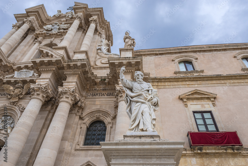 Saint Paul statue in front of Syracuse Cathedral and Archbishop's Palace (right) on Ortygia isle, Syracuse city, Sicily Island in Italy