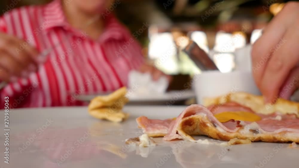 A pieces of pizza with meat, bacon, pepperoni and cheese. Someone takes a piece of hot freshly prepared pizza. Close up shot. A pieces of pizza with meat, bacon, pepperoni and cheese. Someone takes a piece of hot freshly prepared pizza. Close up shot.