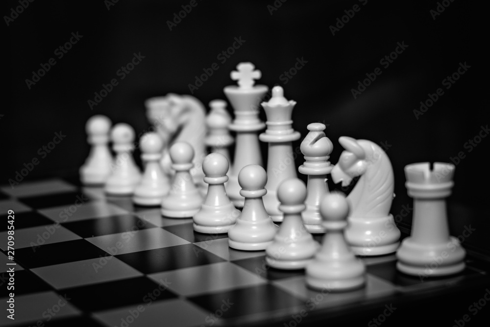 Chess team on a wooden board