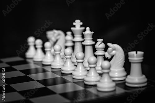 Chess team on a wooden board