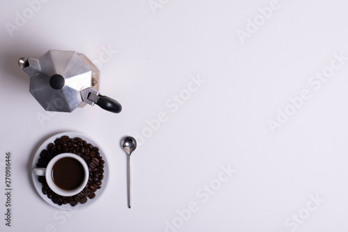 Top view of white espresso coffee cup with espresso coffee on white saucer