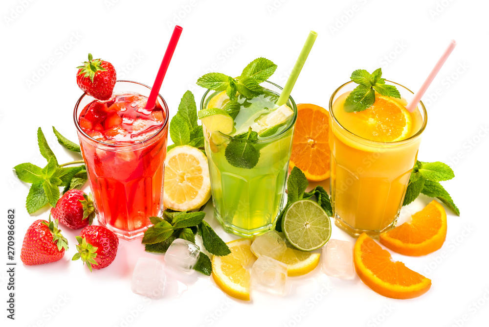 Fruit cocktail in glasses. Fruit drinks made of strawberry, orange, lime, lemon, decorated with mint Fruit cocktail in glasses. Fruit drinks made of strawberry, orange, lime, lemon, decorated with mint