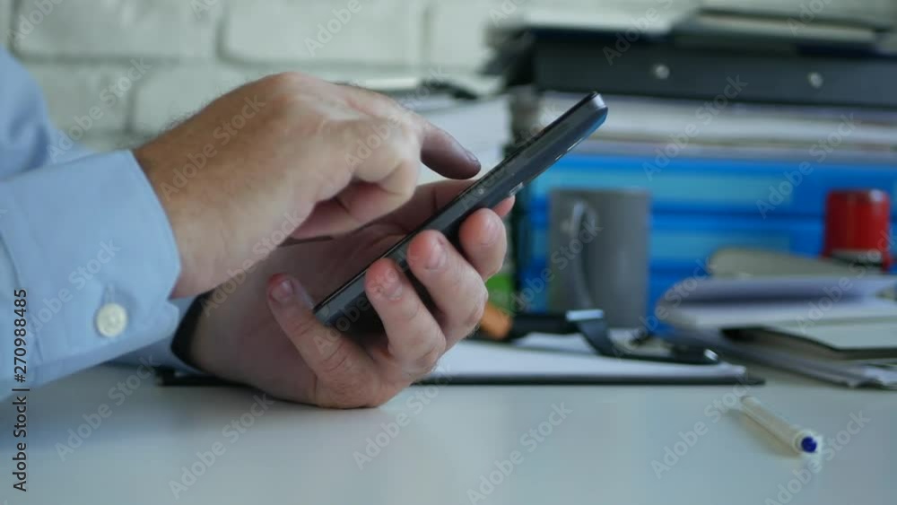 Busy Businessman in Office Text Using Cellphone Internet Communication Busy Businessman in Office Text Using Cellphone Internet Communication