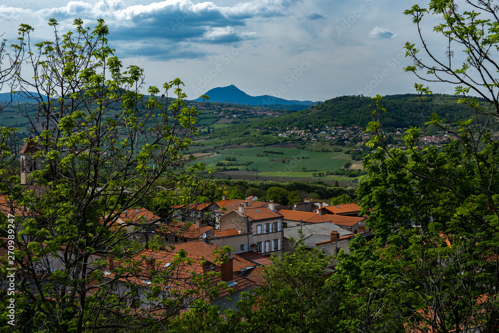 Puy de dome in the distance above rooftops