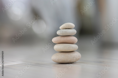 Photography Harmony and balance, cairns, simple poise pebbles on wooden light white gray bac