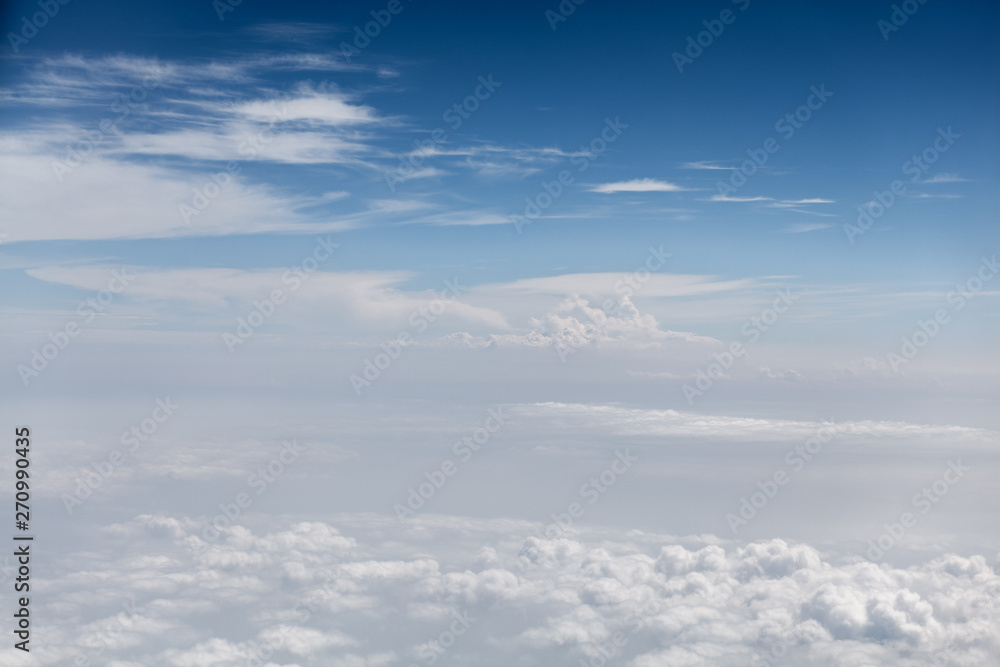 view of the clouds from the window of the plane
