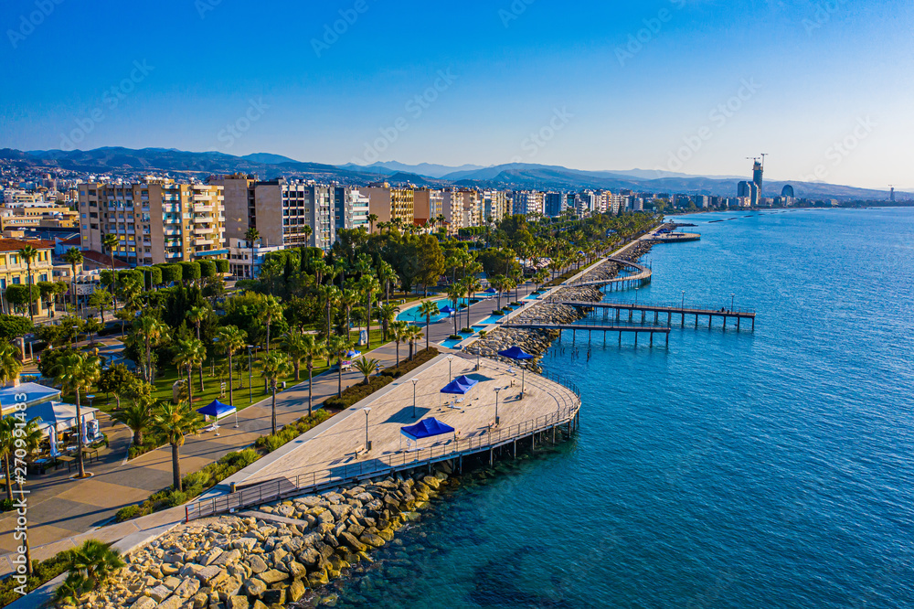 Obraz premium Limassol. Cyprus. The seafront of Limassol Molos day panorama. Beach promenade Limassol from the height. Mediterranean sea coastline. The beaches of Cyprus. Vacation in Cyprus seaside.