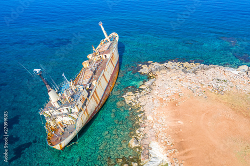 Shipwreck. The ship ran aground the top view. The ship crashed on the coastal cliffs. Abandoned marine vessels. The ship lies on the tank view from the drone.