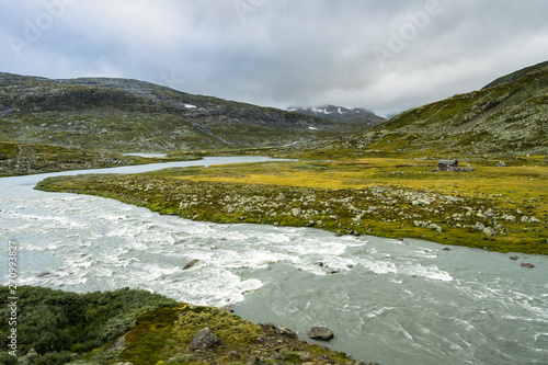 A river in the scenic mountain landscape near Finse in Hardangervidda National Park near Finse, Hordaland, Norway