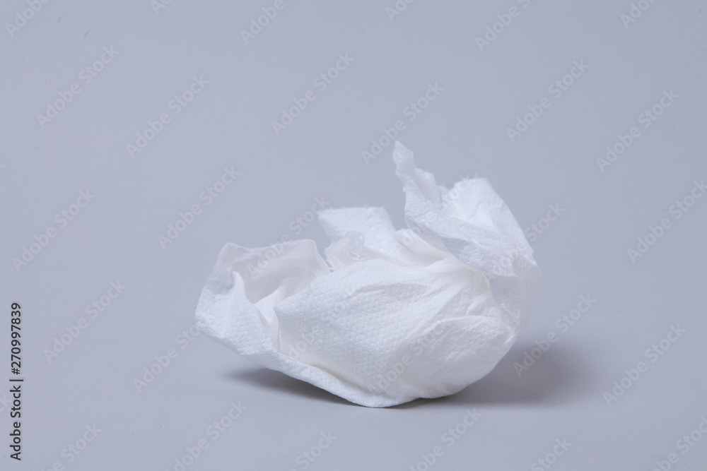 Crumpled toilet roll paper on gray background Crumpled toilet roll paper on gray background