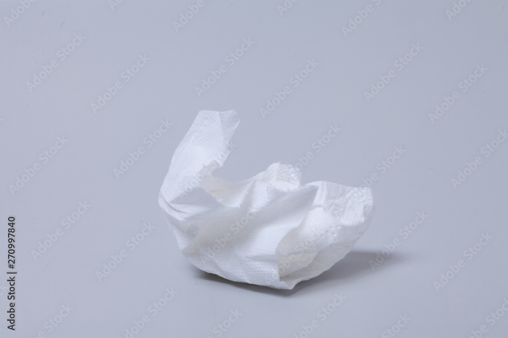 Crumpled toilet roll paper on gray background Crumpled toilet roll paper on gray background