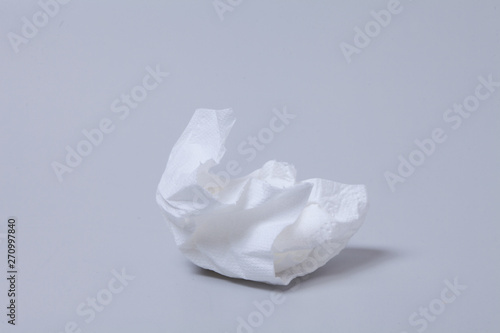 Crumpled toilet roll paper on gray background  © papii