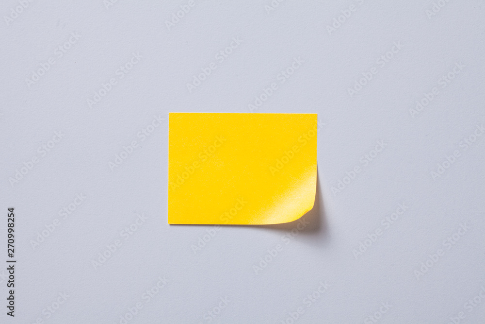 Blank sticky post note on gray background Blank sticky post note on gray background