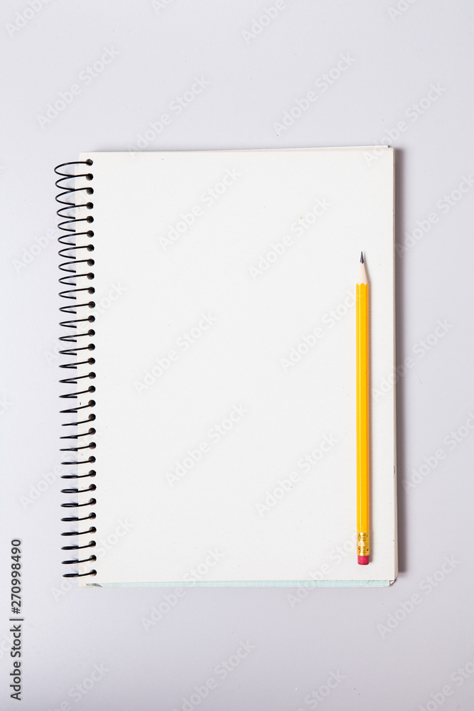 Pencil on blank note pad Pencil on blank note pad
