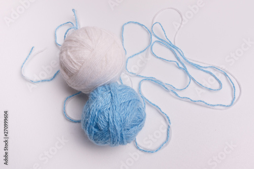 blue and white balls of thread-isolated