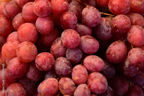 Grapes on the market. Fresh grapes ready to eat. Red grapes