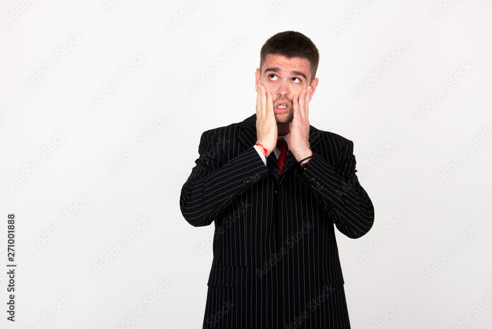 young businessman in black suit surprisingly respond to task and afraid of work young businessman in black suit surprisingly respond to task and afraid of work