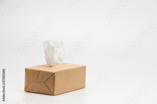 Tissues paper Box with one sticking from the top on a white