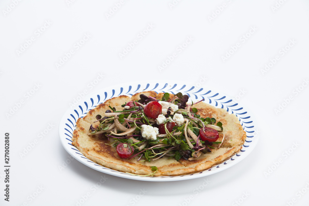 Salad on a Korean pizza on a plate Salad on a Korean pizza on a plate