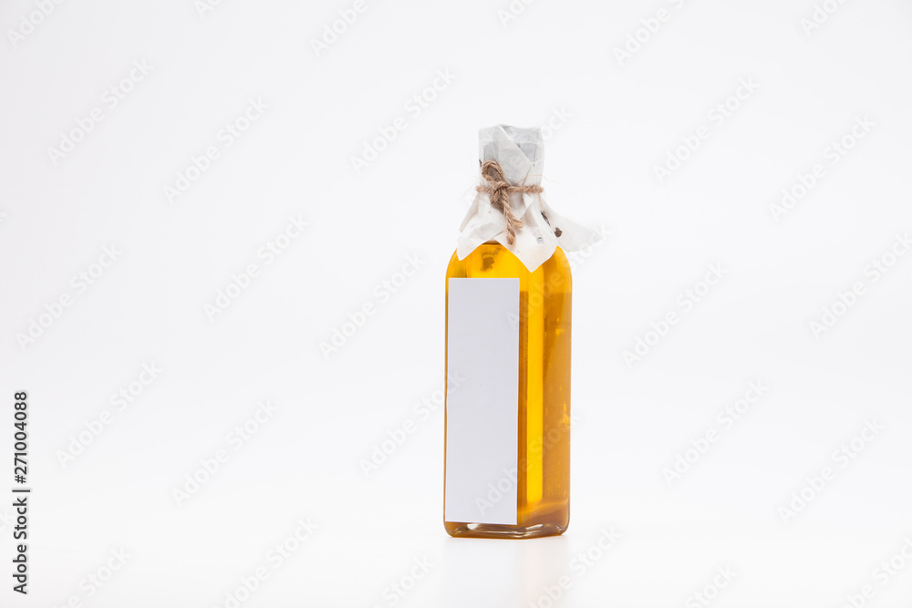 Perill oil in single glass bottle on white background