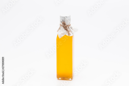 Perill oil in single glass bottle on white background