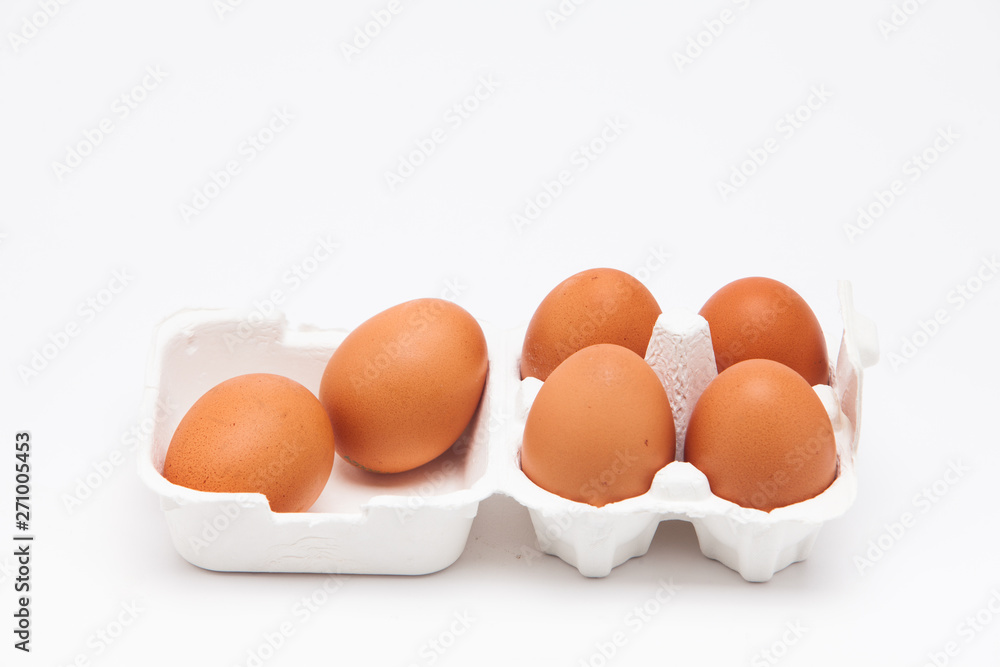 Brown eggs with white eggbox isolated on white background Brown eggs with white eggbox isolated on white background