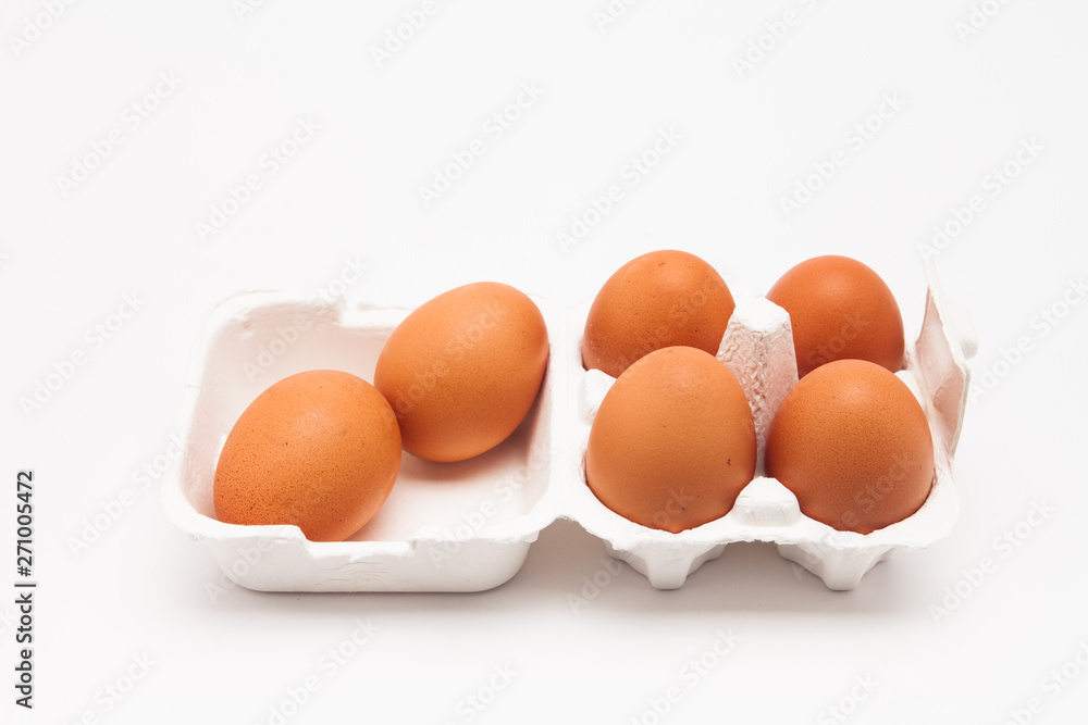 Brown eggs with white eggbox isolated on white background Brown eggs with white eggbox isolated on white background