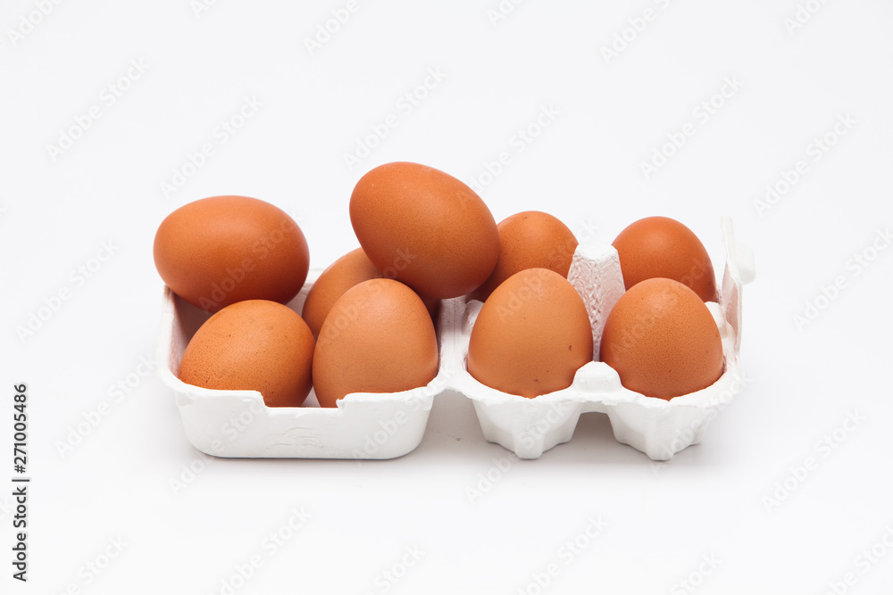 Brown eggs with white eggbox isolated on white background Brown eggs with white eggbox isolated on white background